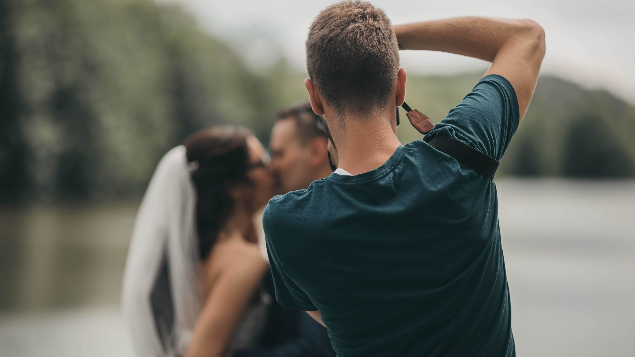 photographer taking photo of newlyweds